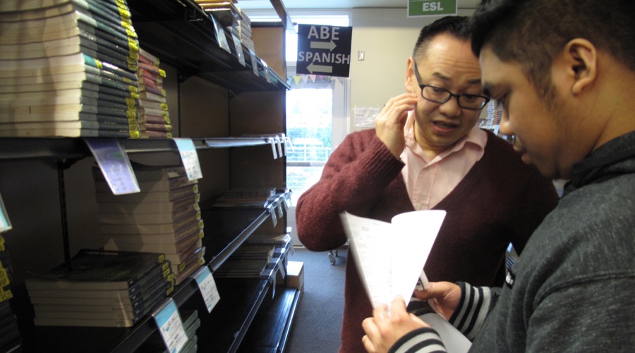 Ekk Sisavatdy, left, helps an incoming freshman at Highline College in Burien, Washington, as part of a program that assists Asian American and Pacific Islander students. Ekk Sisavatdy, left, helps an incoming freshman at Highline College in Burien, Washington, as part of a program that assists Asian American and Pacific Islander students.